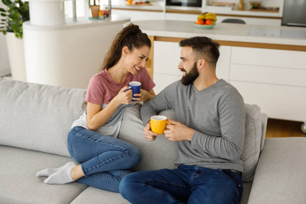 istock Couple relaxing on sofa in their new home 1223391166