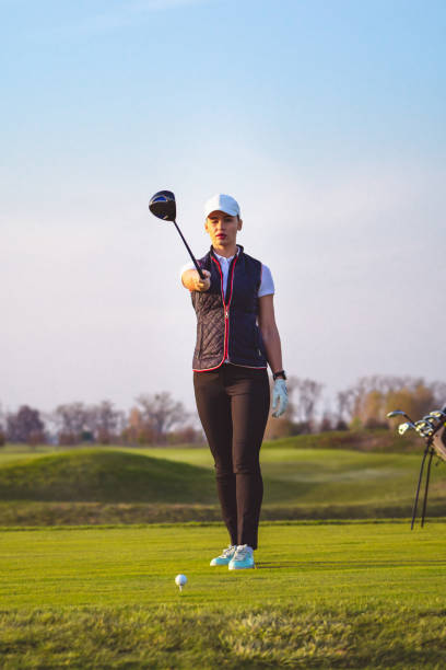 istock Young beautiful woman is training golf in autumn 1223391217