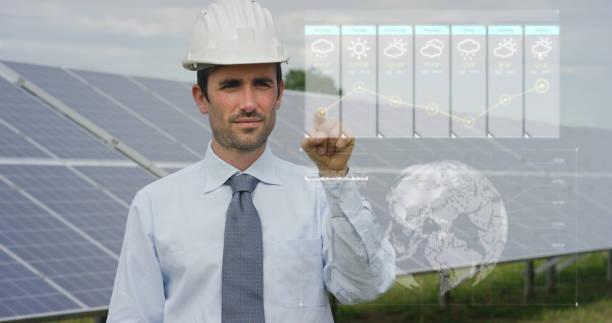 istock Portrait of a young engineer using futuristic technology while checking photovoltaic solar panels. 1223392208