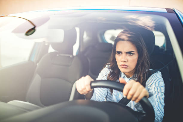 istock Frustrated woman stuck in traffic. 1223392574