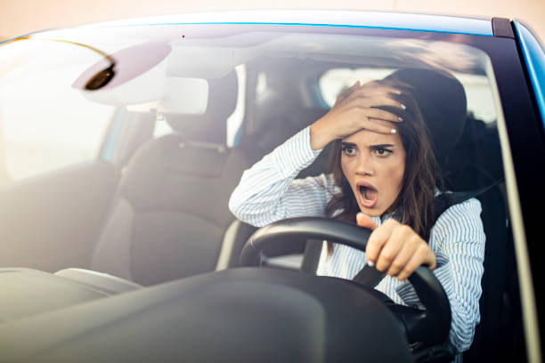 istock Furious woman stucked in traffic jam. 1223392895