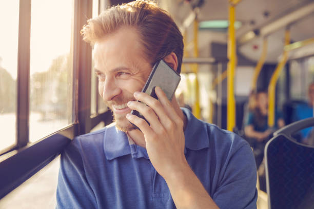 istock Male passenger talking on smart phone in public bus 1223392911