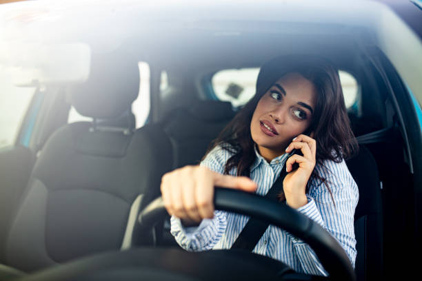 istock Woman In Car Talking On Mobile Phone Whilst Driving 1223393090