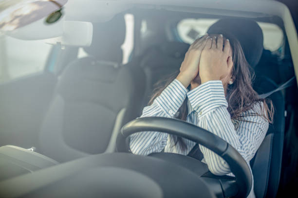 istock Stressed woman driver sitting inside her car 1223393174