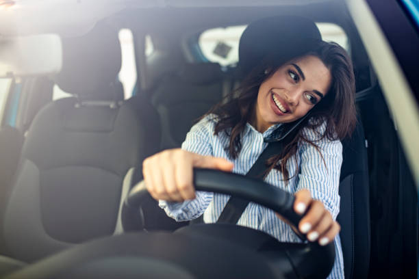 istock Woman In Car Talking On Mobile Phone Whilst Driving 1223393765