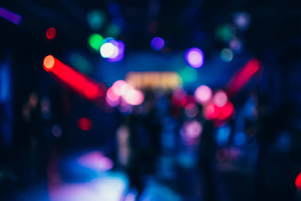 istock Colorful background with bokeh defocused blurred multicolored lights 1223393897
