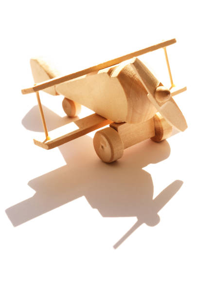 istock Wooden Airplane On White 1223394058