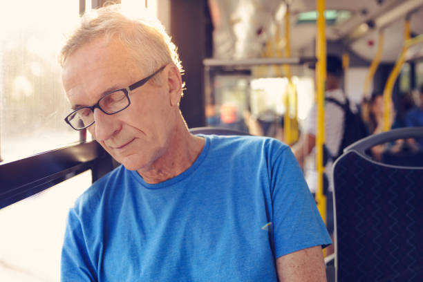 istock Senior man napping in the bus 1223394079