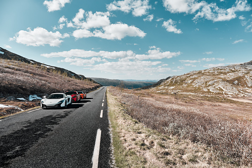 Rjukan, Norway. 04.06.2016: White Mclaren 650s, Red Ferrari f12 and Yellow Lamborghini Huracan