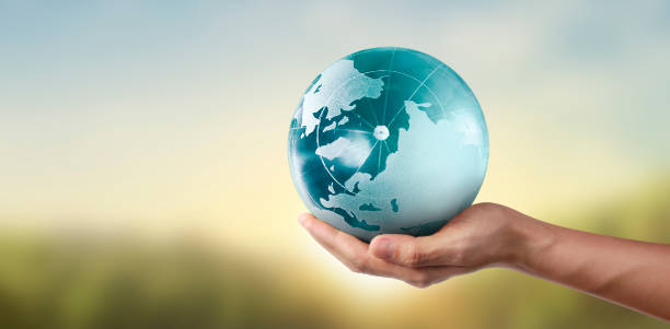 istock Globe ,earth in hand, holding our planet glowing. Earth image provided by Nasa 1223399279