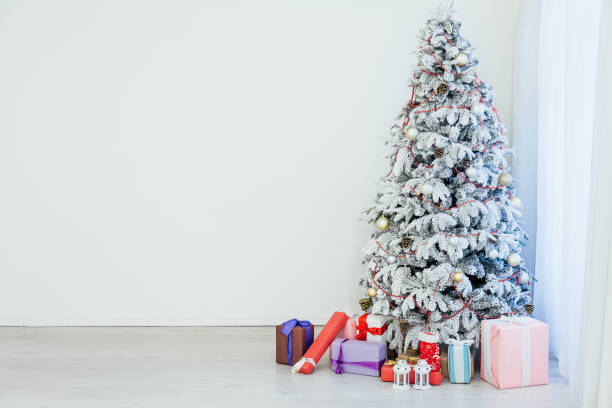 istock White Christmas Tree New Year presents holiday 1223401138