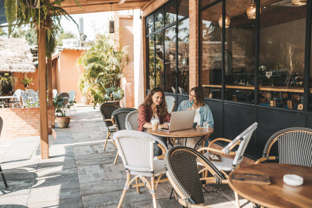 istock Two women discussing business projects in a cafe while having coffee. 1223401213