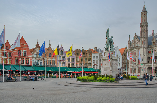 Medieval Bruges Market square with market stalls, shops