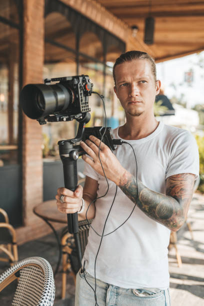 istock Professional man videographer with gimball video slr 1223403048