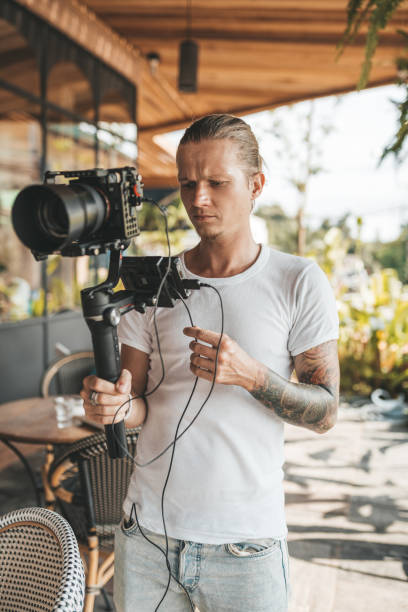 istock Professional man videographer with gimball video slr 1223403049