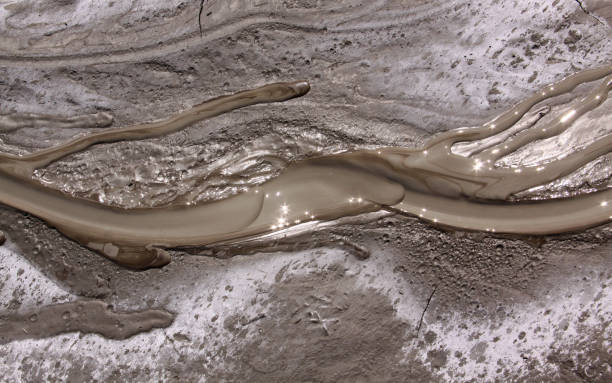 Mud liquid flowing from mud volcano, Romania stock photo