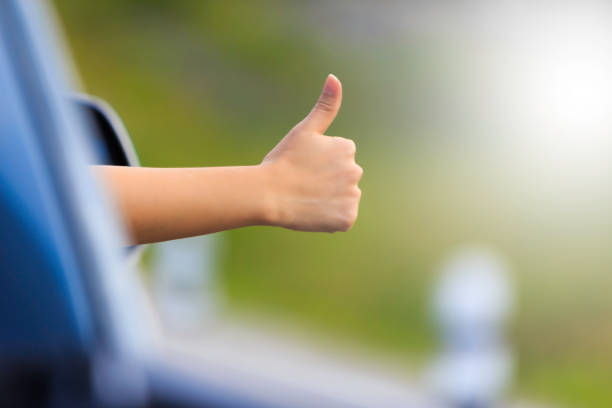 hand thumbs in the car on the road hand thumbs in the car on the road safety first at work stock pictures, royalty-free photos & images