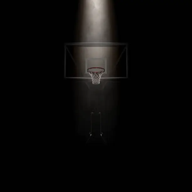 A concept showing a regular basketball hoop dramatically spotlit from above on an isolated dark background - 3D render