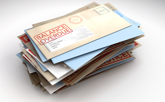A pile of envelopes with delivery stamps saying balance overdue symbolizing bills and debt on an isolated white background - 3D render