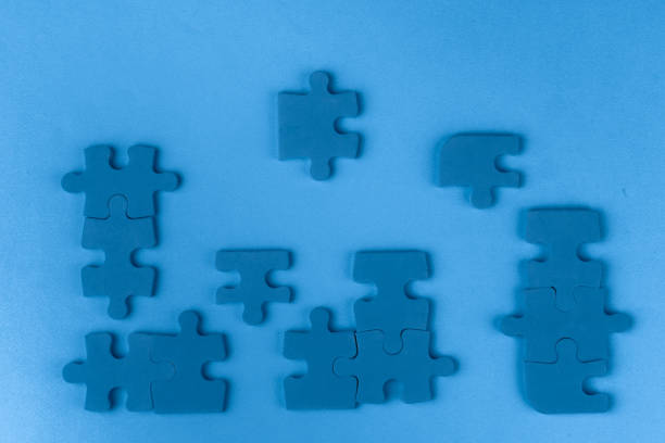 istock Puzzle pieces on classic blue background, top view 1223414539