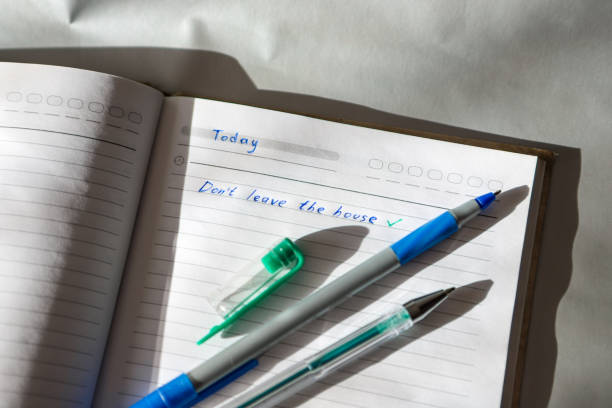 istock Do not leave the house - the inscription in the notebook in a cage. Self-isolation. Quarantine. Security. 1223414864
