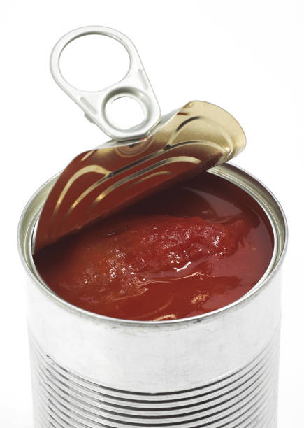 istock TIN OR CAN OF TOMATO AGAINST WHITE BACKGROUND 1223416508