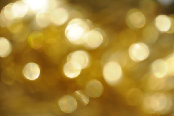 istock gold and yellow abstract bokeh lights. defocused background 1223417527