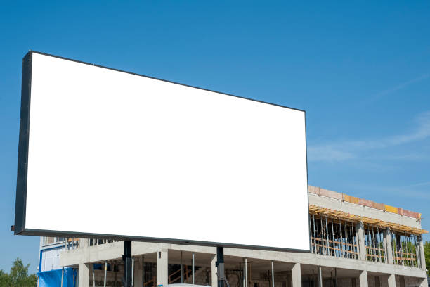 istock Blank white billboard for advertisement in the front of construction site on a sunny day. 1223418777