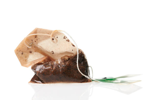 istock one used tea bag, macro photo high detailed, isolated object on a white background 1223421681