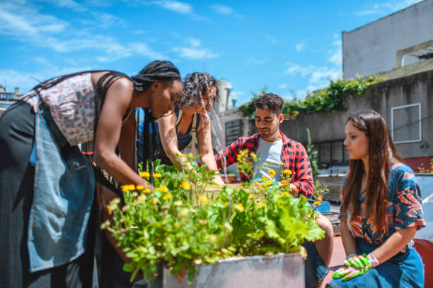 istock Young Community Members Learning From Roof Gardener 1223423011