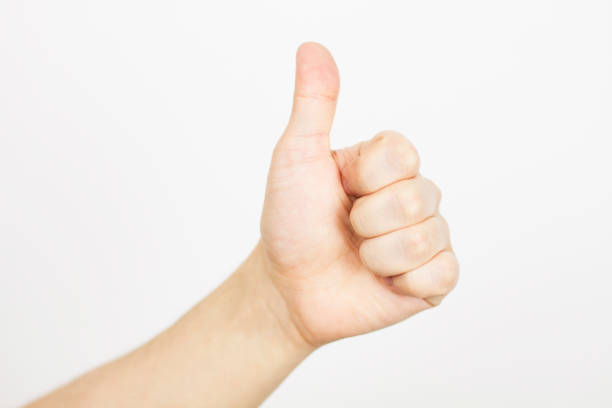 istock approving hand - showing like isolated on white, copy space - selective focus 1223423540