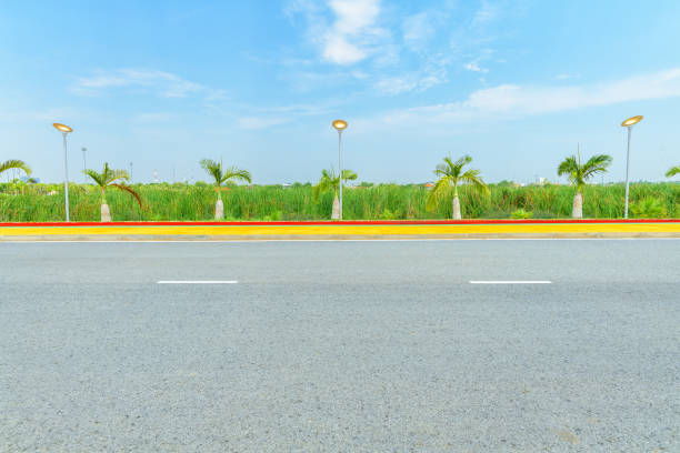 Asphalt road side view and blue sky