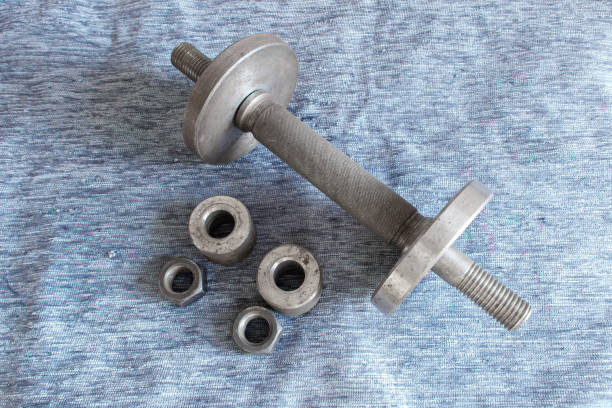 istock Disassembled metal dumbbell on the table 1223426065