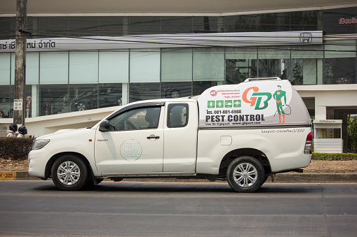 Chiangmai, Thailand -  April 6 2020: Pick up truck of Pest Control company. Service for control pest in home and Building. Photo at road no.1001 about 8 km from city center, thailand.