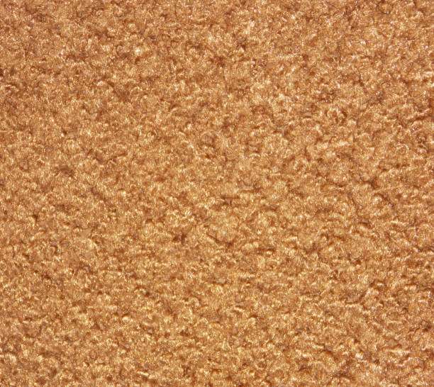 istock Golden brown shiny upholstery material texture 1223431374