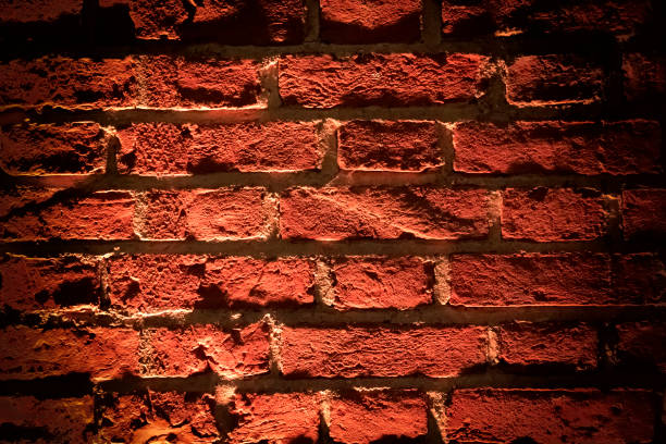 istock Red brick wall texture grunge background with vignetted corners. Grunge weathered stone texture. 1223431456