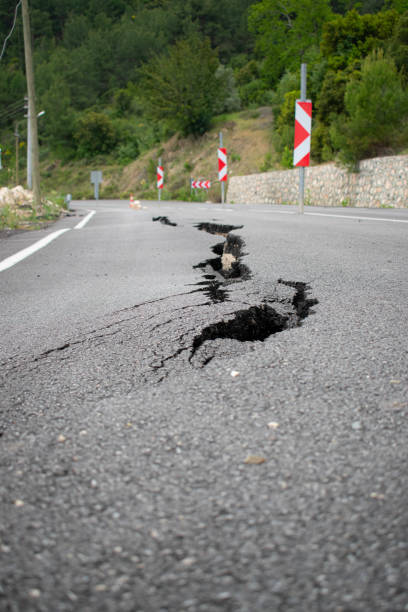istock landslide fractures on the highway,Road collapses with huge cracks.Earthquake. 1223431582