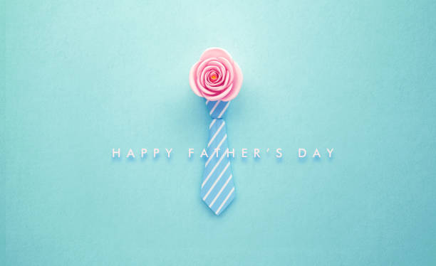istock Pink Rose and Turquoise Tie on Teal Background 1223432025