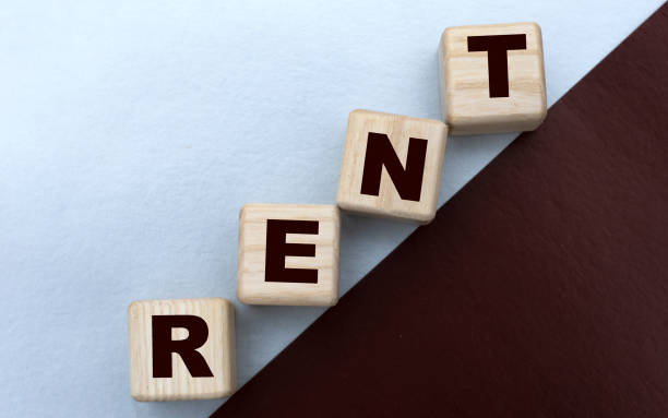 istock RENT , the word is written on cubes on a gray brown background 1223433178