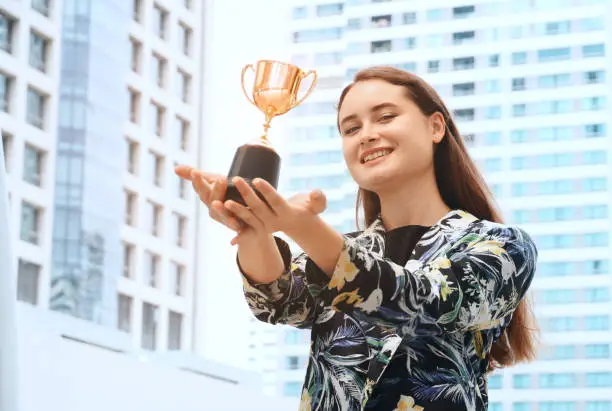 Photo of Achieve business woman receive trophy,win concept.