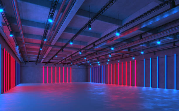 Large empty indoor hall illuminated by an array of neon lights