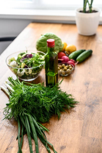 istock Fresh vegetables and greens on the table for salad 1223442011