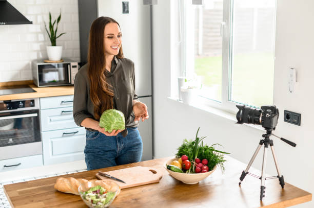 istock A young woman is recording video cooking lessons 1223442155