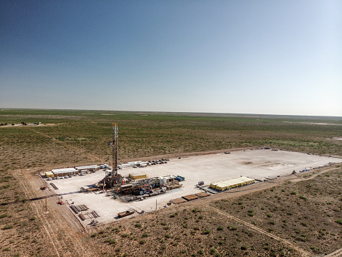 Drone view of an oil and gas drill rig, fracking in West Texas, near Pecos
