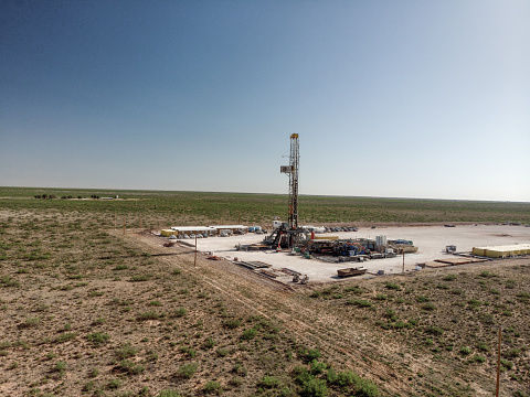 Drone view of an oil and gas drill rig, fracking in West Texas, near Pecos