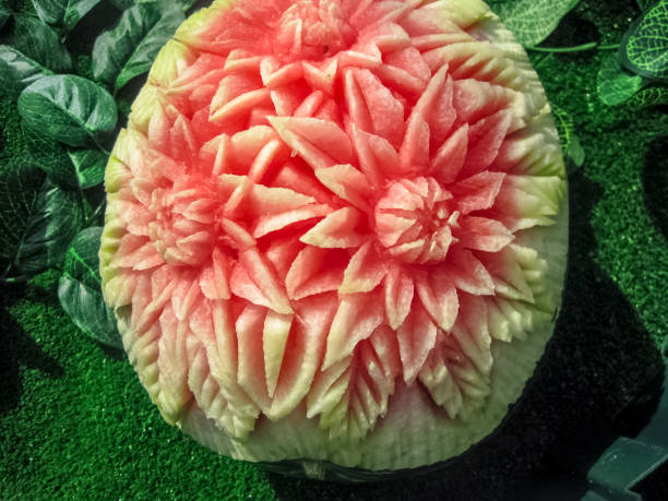 Carving on watermelon. Cut patterns on the watermelon peel. Carving on a watermelon. Cut patterns on the watermelon peel. fruit carving stock pictures, royalty-free photos & images