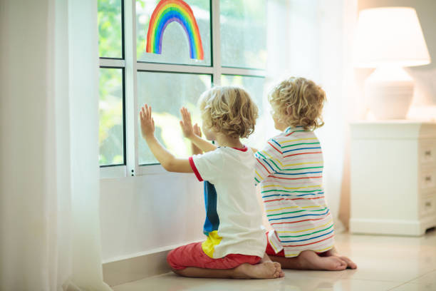 istock Coronavirus quarantine. Kids at window. Stay home. 1223444318