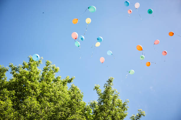 balloons fly away on a background of blue sky