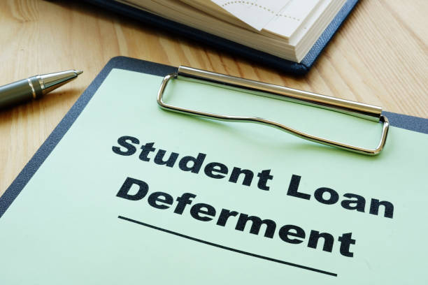 istock Student loan deferment application and clipboard. 1223446392