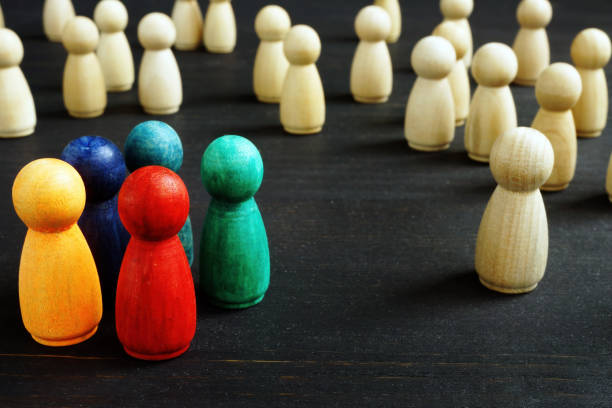 istock Inequality and racism concept different wooden figures. 1223446507